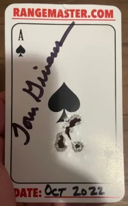 playing card with bullet hole